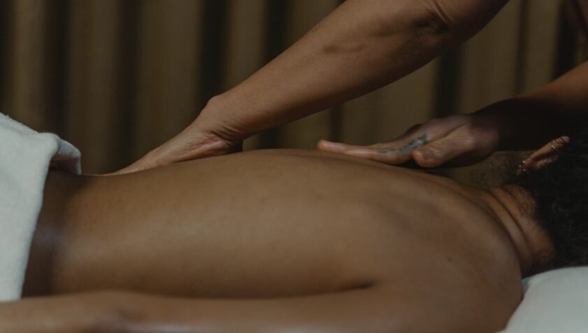 Image of a person getting a massage, holistic therapies in Hackney at The Holding Space